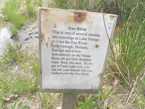 The farm sign marks a stream that forms the Eno River.