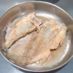 A quick fry prepares the croaker for supper.