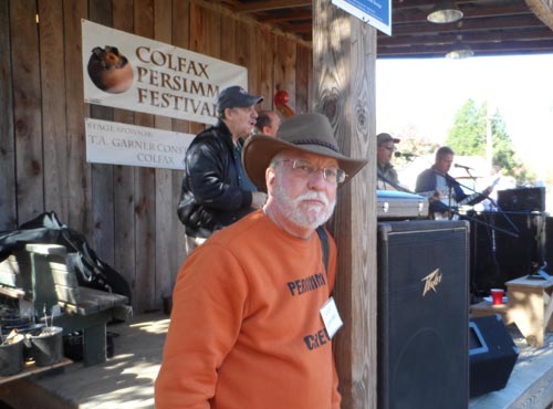 Gene Stafford, festival founder and organizer, takes a momentary break to listen to traditional music.