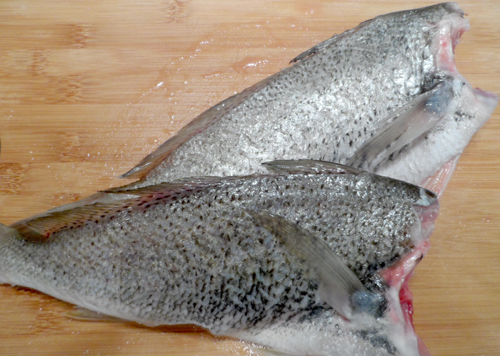 Unwrapped after the trip to a home, two croaker are ready for the pan.