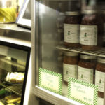 Downtown Bakery owner and baker, Kate Simmons, sells batches of homemade pizza sauce (4.99) and dough ($1.00).