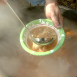 Fish stew contains rounded, perfectly-poached eggs