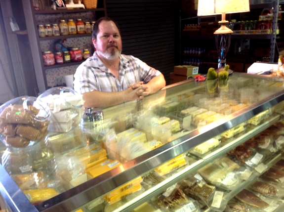 Jeff Lee sells Ashe County cheese at the Roberts Family Farm outlet at the State Farmers Market in Raleigh.