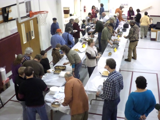 A crowd quickly forms to sample the wild food dishes during the “tasting party” of the contest.