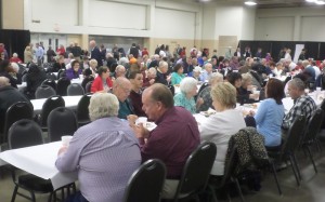 Tables at the Expo Center are quickly filled as the dinner is served. (Ray Linville)