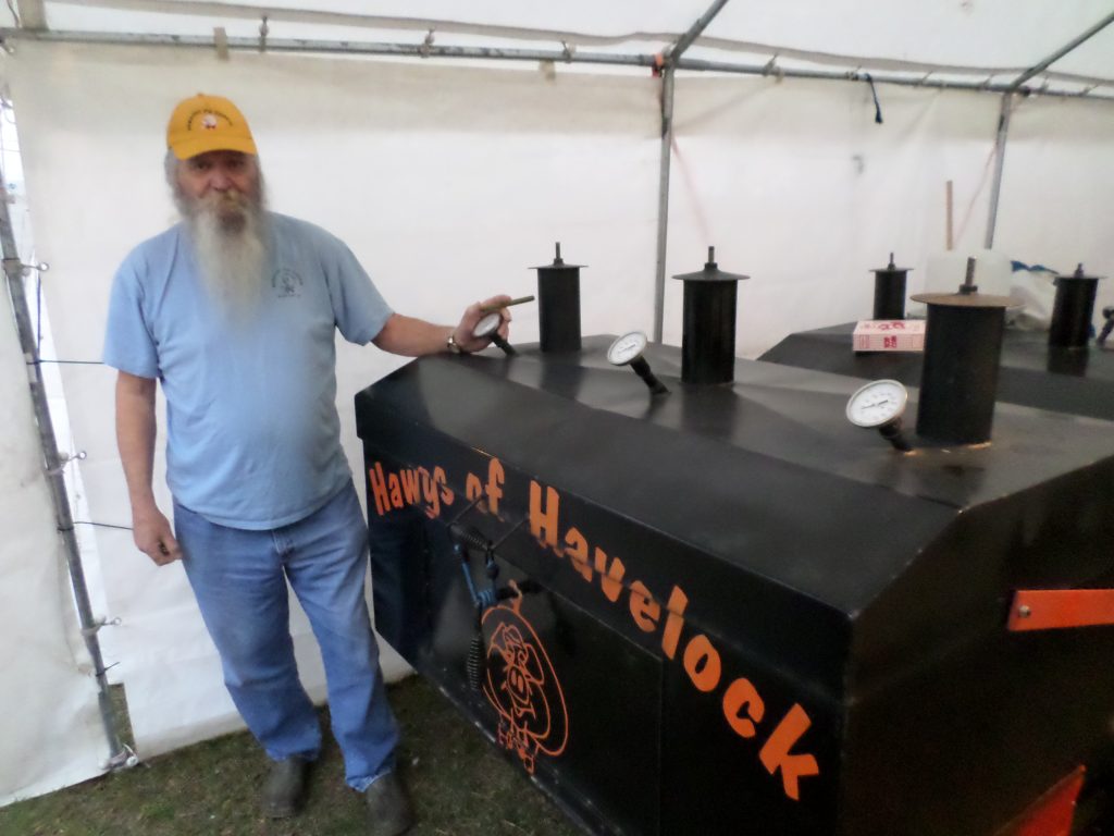 Long-term participant Smokey Colwell shows off his cooker.
