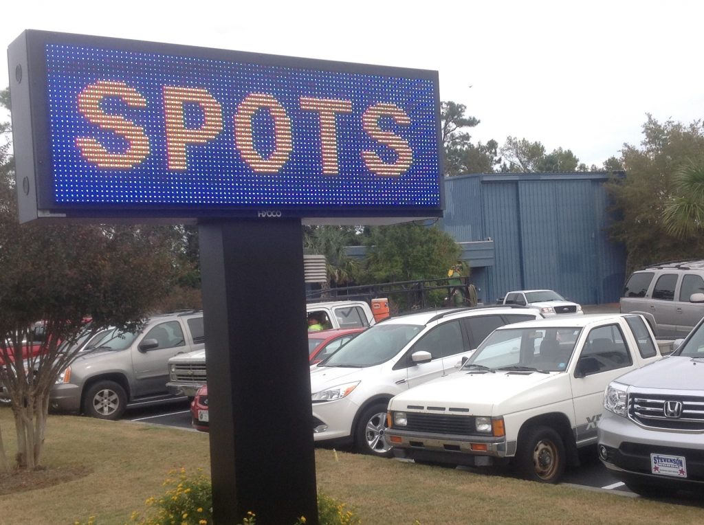 The streetside sign of Boathouse Restaurant in Wilmington simply says, “Spots.”