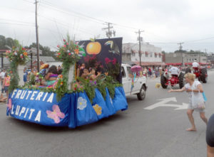 Children who ride on the floats and vehicles in the parade are visibly proud of how successfully their families grow peaches.