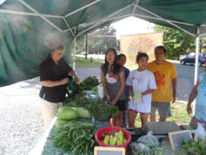 Gourds, peppers, okra, beans, tomatoes, and other produce are sold to market customers in the summer months.