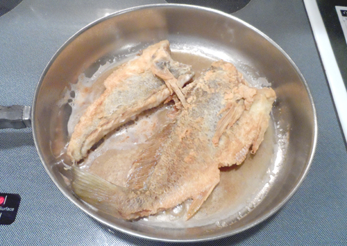 A quick fry prepares the croaker for supper.