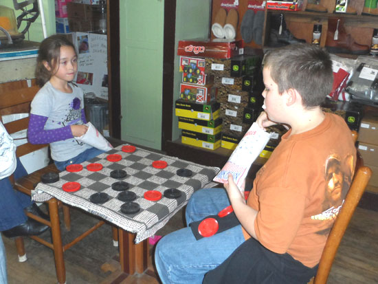 Children playing checkers at Brown's Hardware in Mount Gilead, NC.