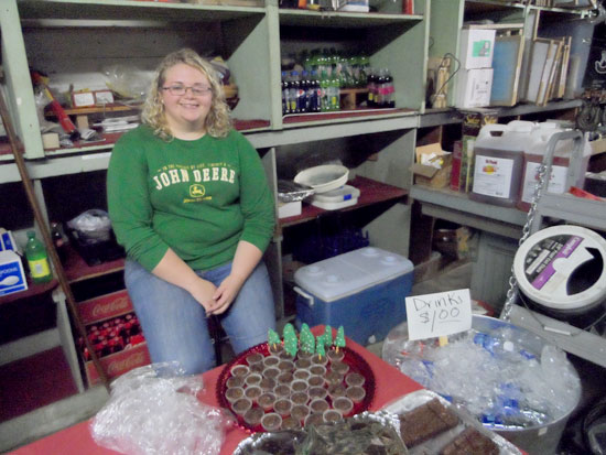 Mistie Jo Williams, who works part-time at Brown’s Hardware, offers sweet treats to complement the Brunswick stew.