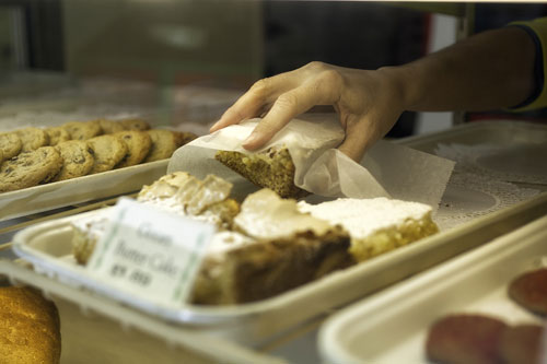 Co-worker, Shawn Woody, reaches in for a Gooey Butter Cake