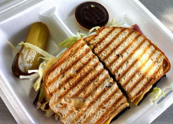 Pastrami and sharp Swiss Cheese on Rye with lettuce, tomato, onion, Polish mustard and mayonnaise.