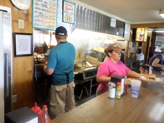 The grill at The Hub stays busy as it serves customers who don’t order from the choices at the cafeteria-style area.