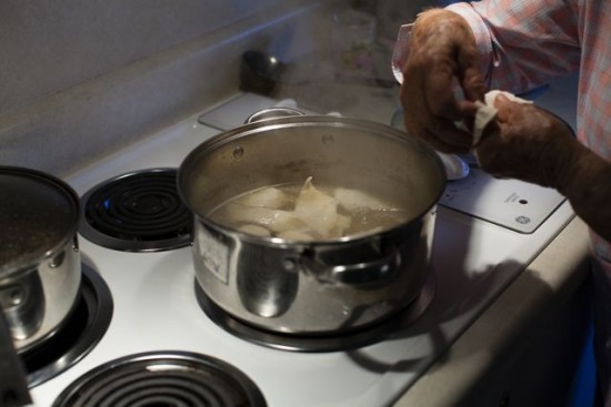 Dropping the pastry into the stock.