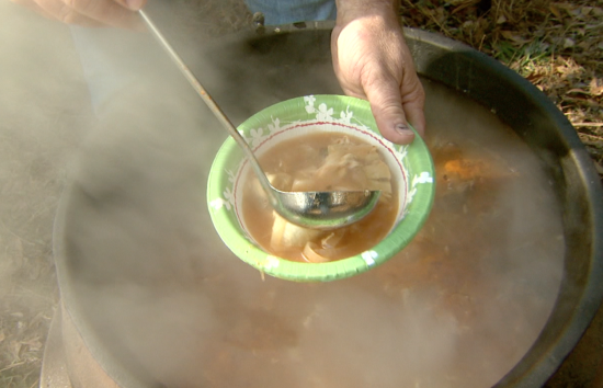 Fish stew contains rounded, perfectly-poached eggs