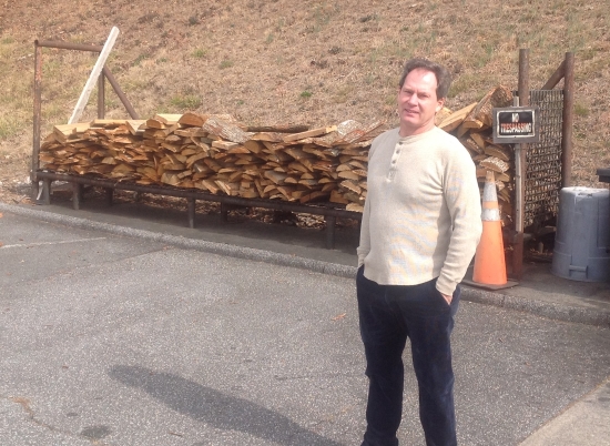 JR Hill uses lots of hardwood to smoke pork shoulders just like his grandfather, who started the restaurant.
