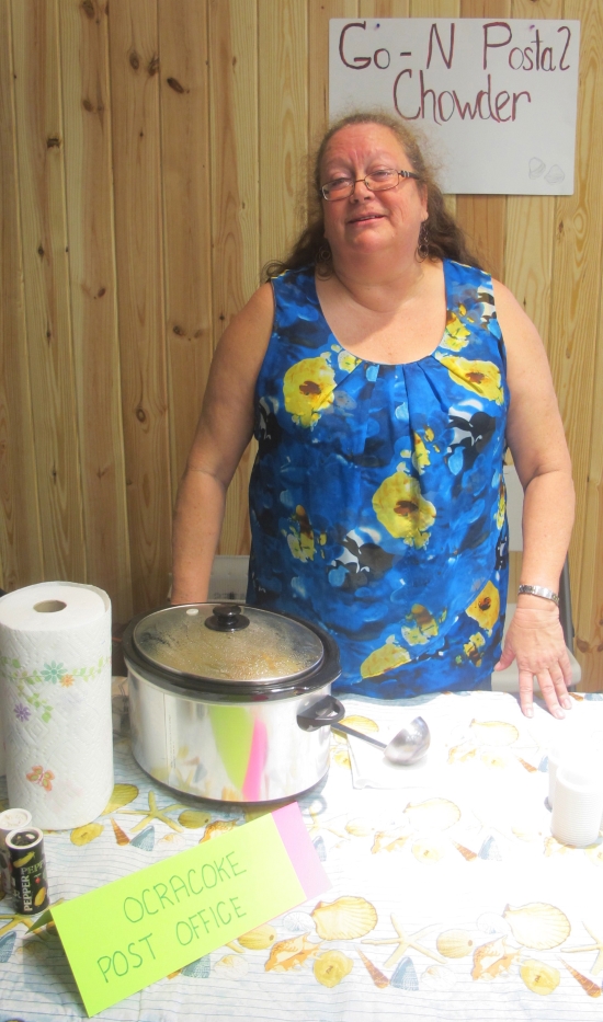 Go-N Postal Chowder: Celeste Brooks, Ocracoke’s postmaster, served the entry from the post office staff. Ingredients, as written on a sign: fresh locally harvested clams, Irish taters, onion, streak-o-lean, clam juice, salt, pepper. Photo: Leanne E. Smith, 4-4-2015.