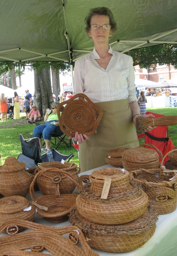 Margaret Raby with pine needle baskets. Saturday, June 20, 2015. Photo: Leanne E. Smith.