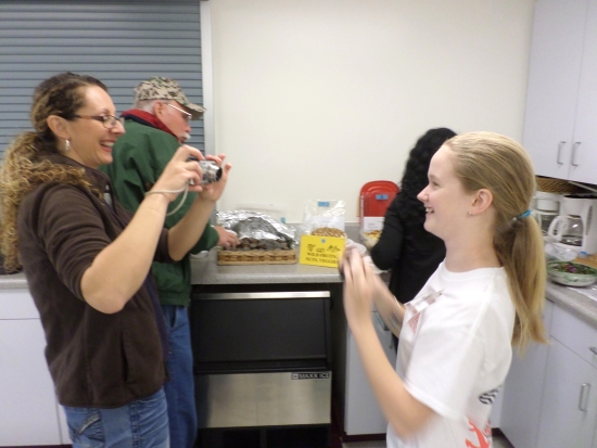  Tiffanee Conrad, contest coordinator and agriculture-livestock extension agent in Richmond County, (left) and Payton Smith, winner of the youth category, clown around by taking pictures during the event. joke