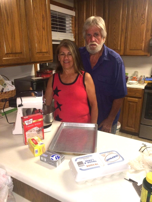 My grandparents, Dora and Steve Efird, stand with chess cake supplies around them.