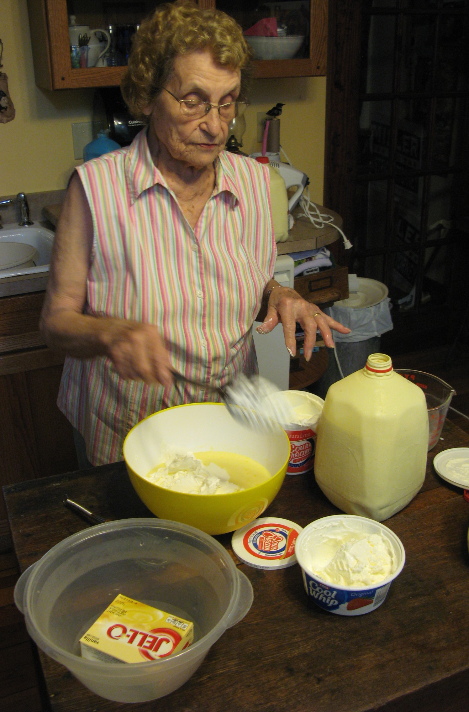 Elizabeth Roberts adding about four ounces of Cool Whip to one recipe of the pudding mixture. Friday, June 12, 2015. Leanne E. Smith.