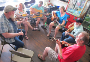 Musicians, including locals Gary Saunders (center, guitar) and Patrick Crouch (front, right), and Dan and Christy Foster of Texas (left, fiddle and guitar). Of course, the group sang a version of “Tom Dooley” during the jam session. Monday, September 7, 2015. (Leanne E. Smith)