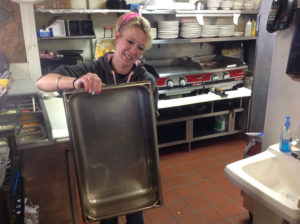 Nicole Hammell, cook at Heritage Diner for 10 years, shows the pan she uses to make chicken pot pie. It sold out two hours after the lunch period had begun and the pan had already been cleaned before lunch ended. (Ray Linville)