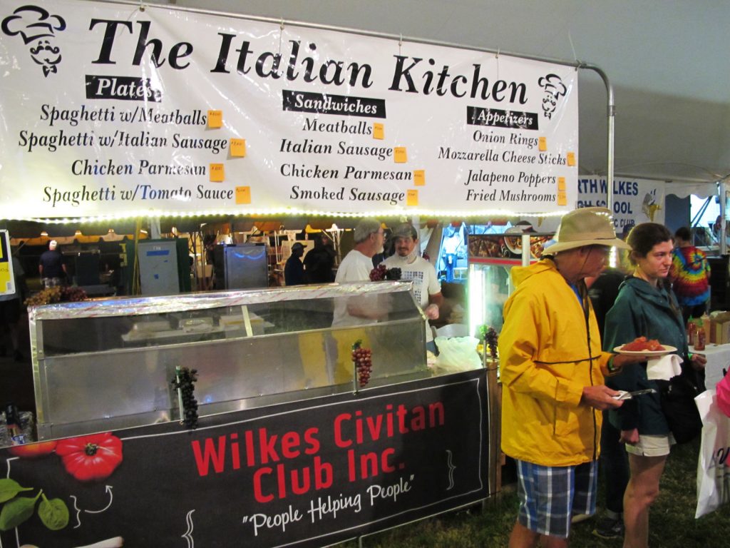 Customers and their spaghetti plates at the Wilkes Civitan Club booth.