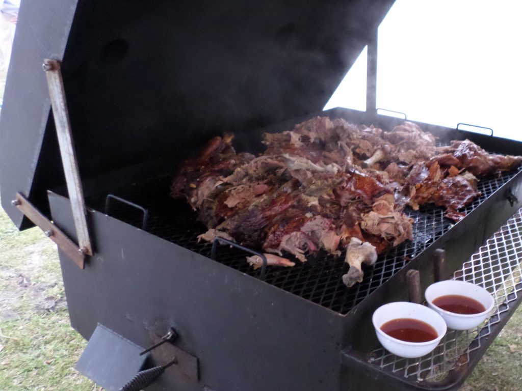 After the judges have completed their evaluation, the cooked pig shows the signs of a detailed inspection.