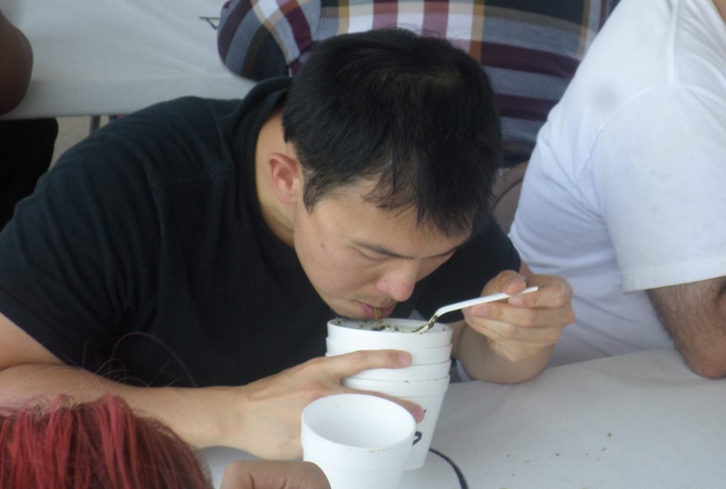 Mario Christianto, the top male finisher, shows his winning form en route to eating more than five pounds.