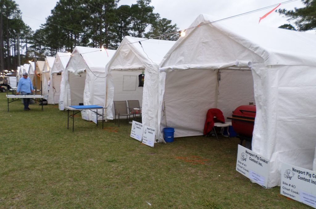 Cooking teams are housed in protective tents assembled side by side in Newport Community Park. 
