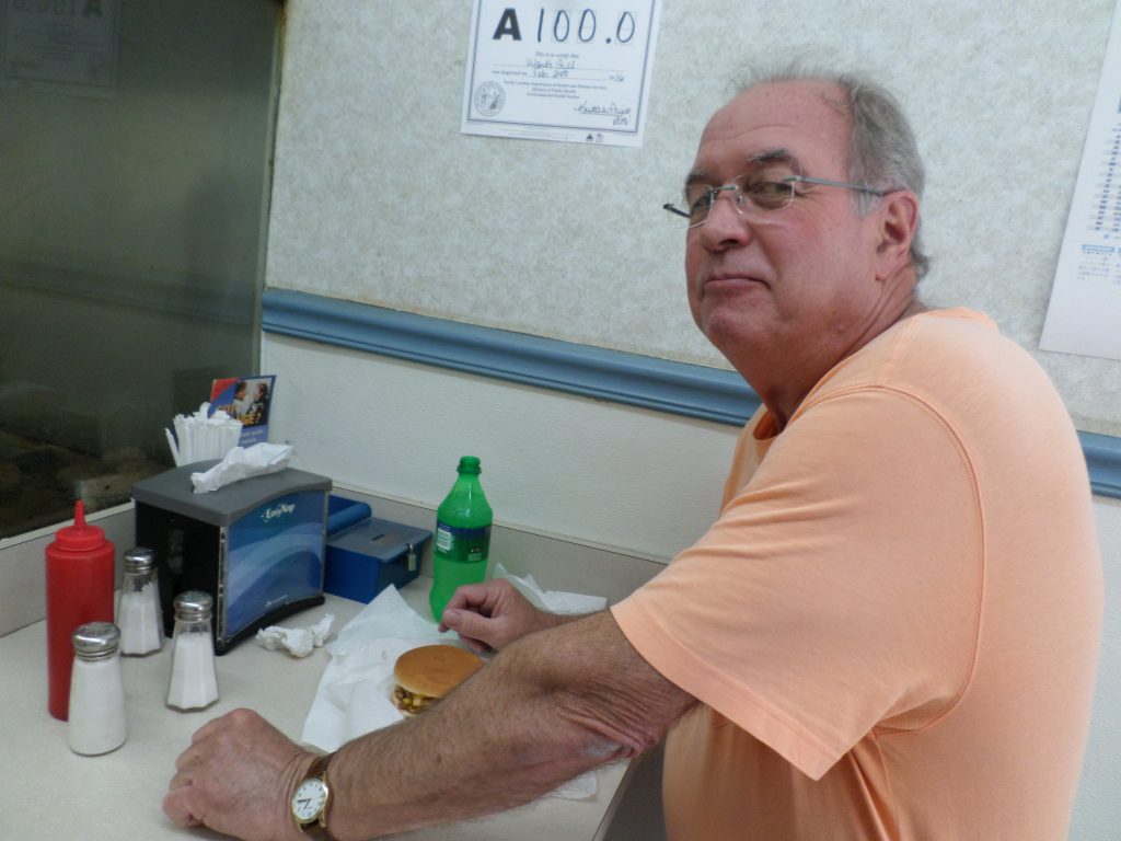 Tucked in a corner of the counter, Charlie Duncan enjoys his daily lunch.