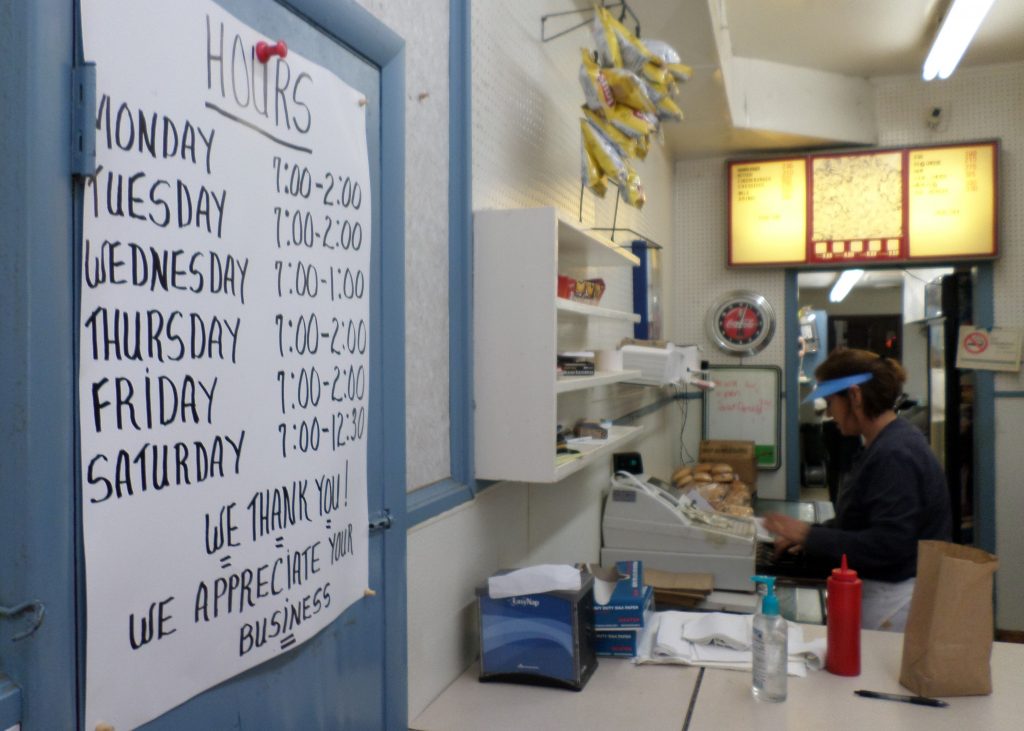 Kandle Rogers keeps the cash register humming as she bags orders.