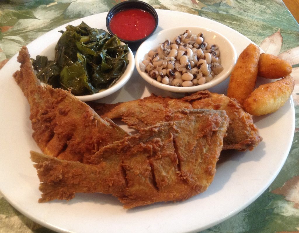 A plate of spots usually comes with two sides, such as collards and black-eyed peas.