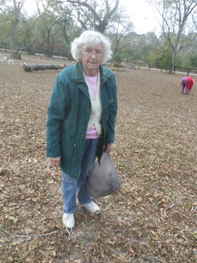 Christine Burns totes a bag that gains more weight with each minute of picking.